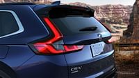 Rear of Sport Touring Hybrid Honda CR-V 2023 with AWD shown in Canyon River Blue Metallic.